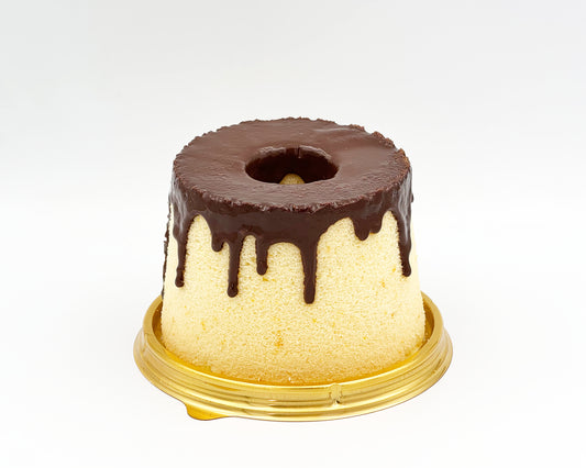 small chiffon cake with chocolate drip on a white background