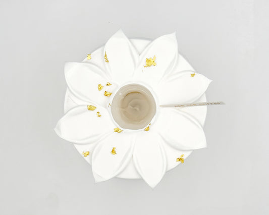 White flower-shaped chiffon cake, top view, on a light gray background