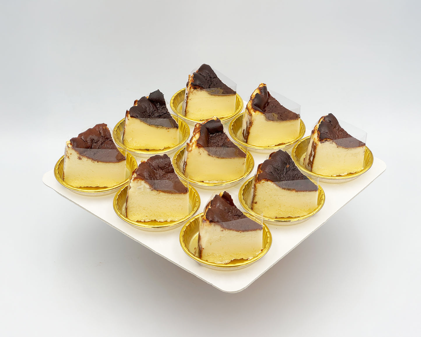 bite-sized sliced basque burnt cheesecake on a white plate