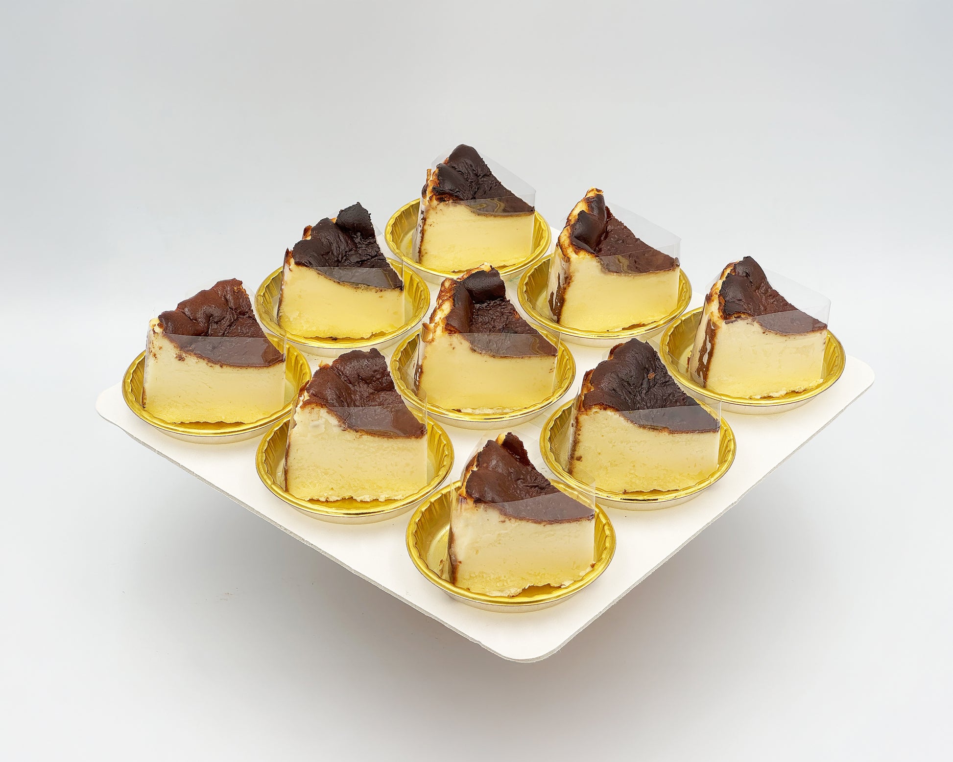 bite-sized sliced basque burnt cheesecake on a white plate