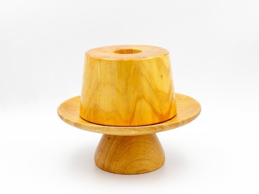 Wooden chiffon cake mould on a white background