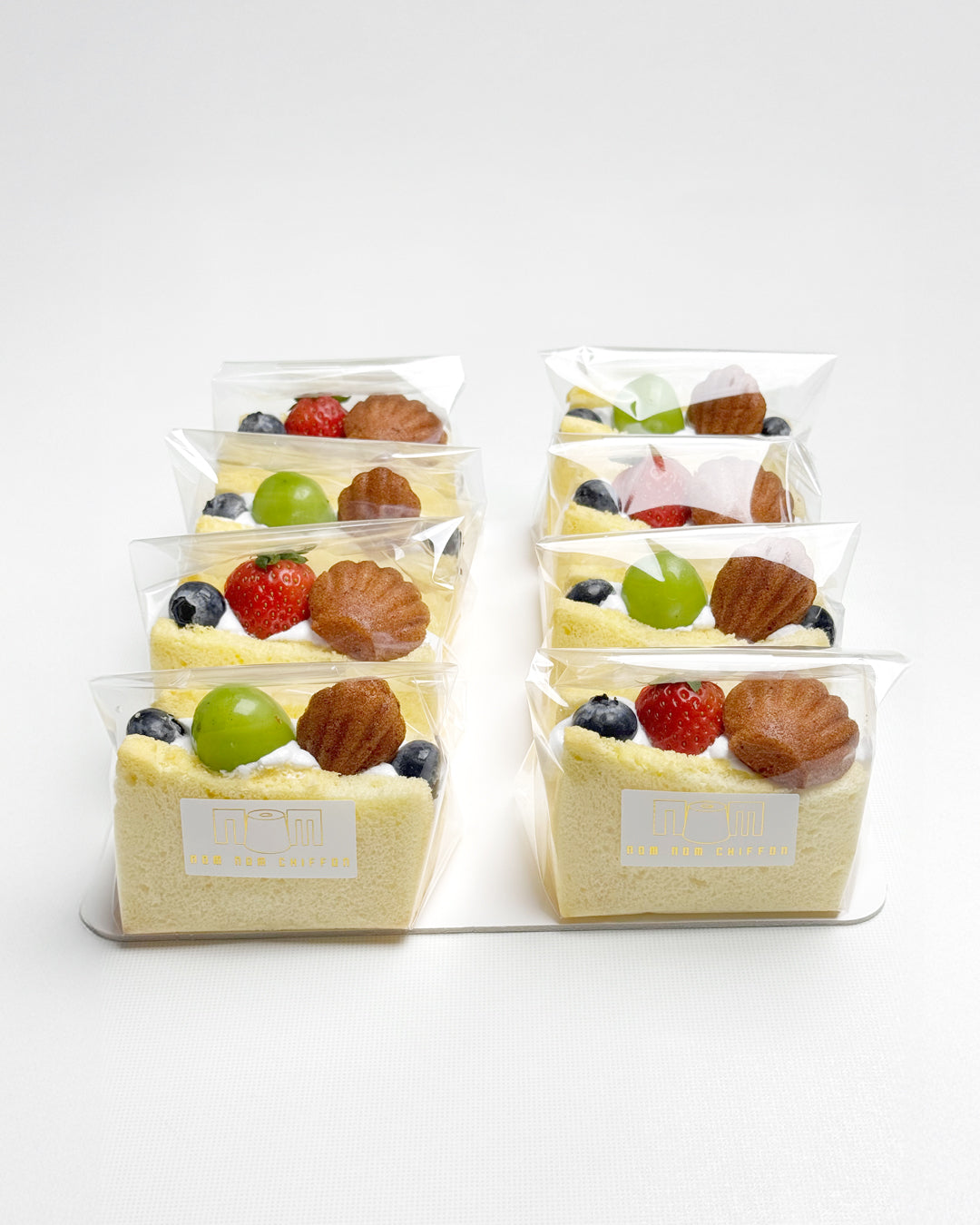 Packaged vanilla chiffon fruit sando on a white background