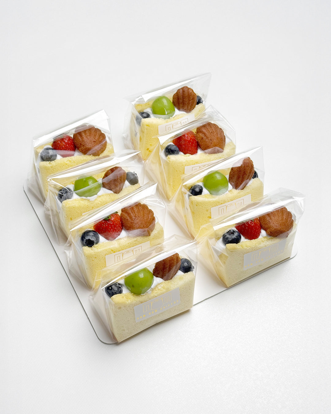 Packaged vanilla chiffon fruit sando  on a white background