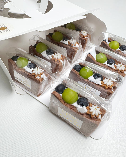 Packaged chocolate chiffon fruit sando on a white background