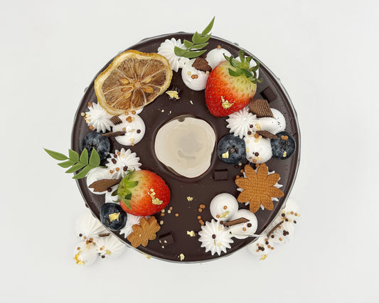 Top view, Decorative chiffon cake with fruits and flowers on a white background