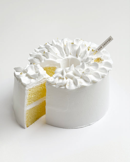 White flora cake with vanilla on a white background