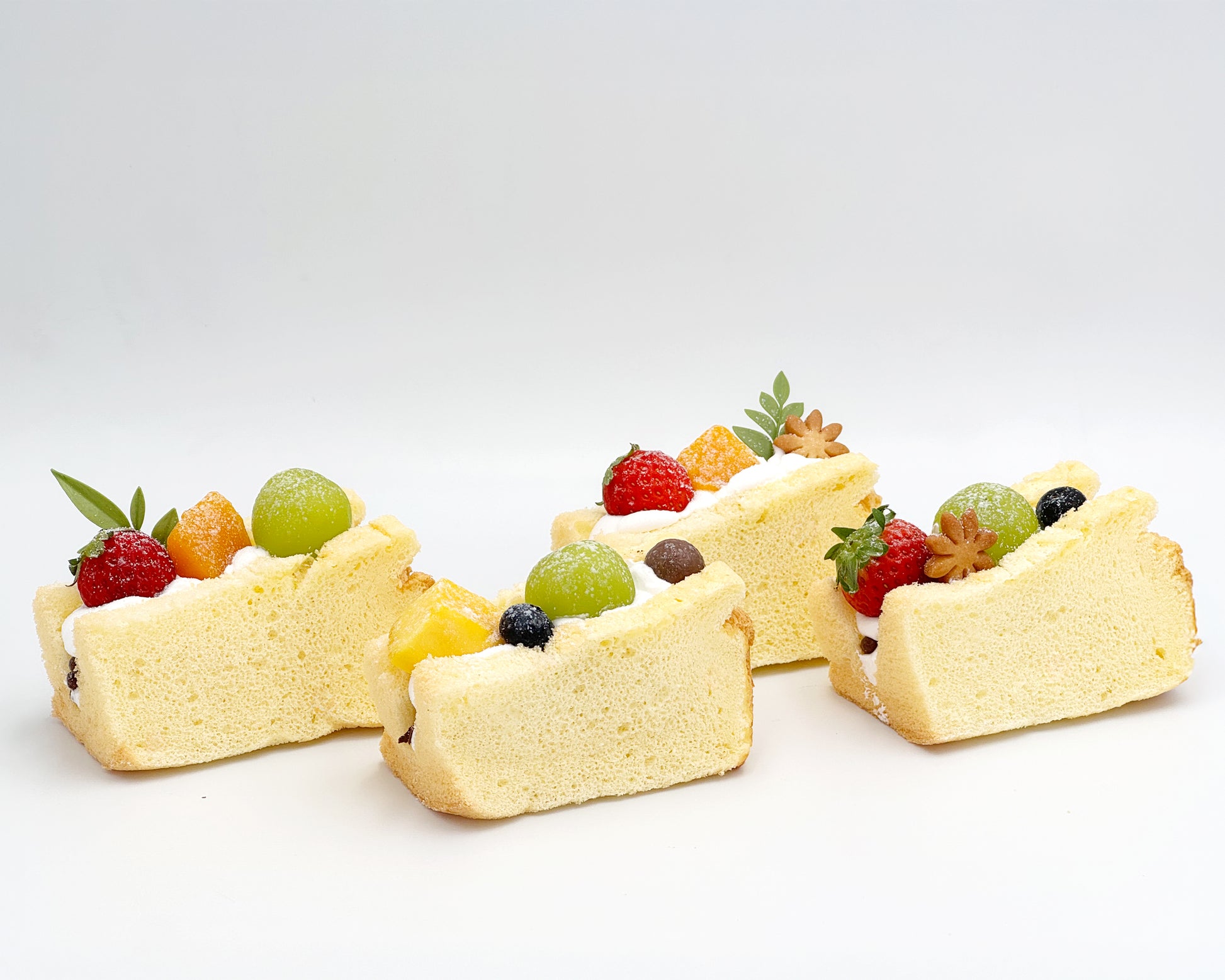 Vanilla chiffon fruit sando on a white background