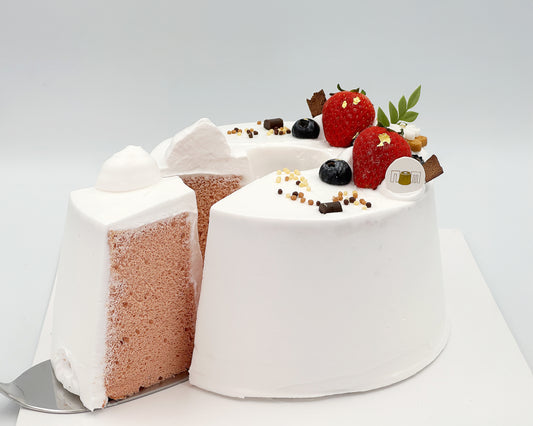 Gender reveal cake with strawberries and chocolate on a white background