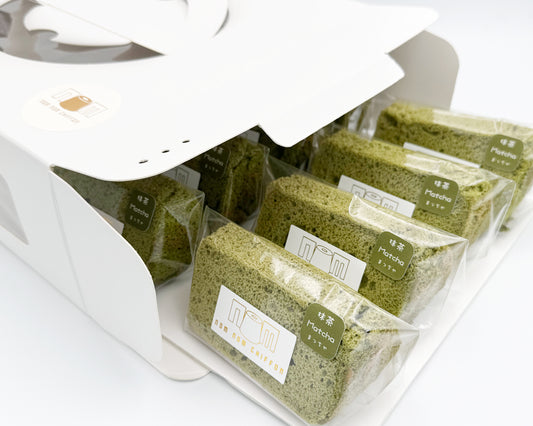 Packaged premium matcha chiffon cake slices in clear plastic packaging on a white background