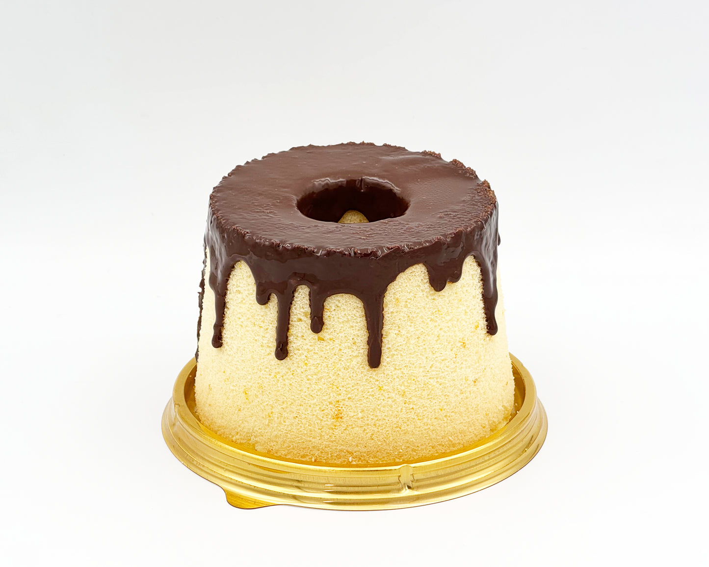 small chiffon cake with chocolate drip on a white background