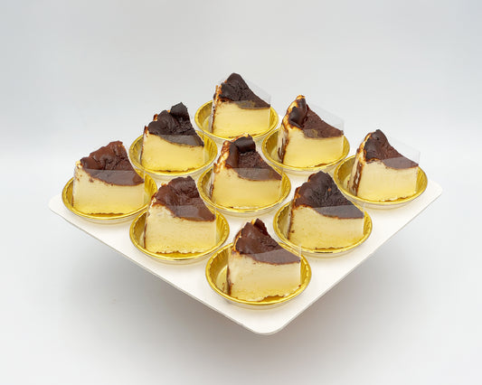 bite-sized sliced basque burnt cheesecake on a white plate